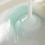 AXIS-Y Vegan Collagen Eye Serum texture – lightweight creamy formula blending white and aqua tones