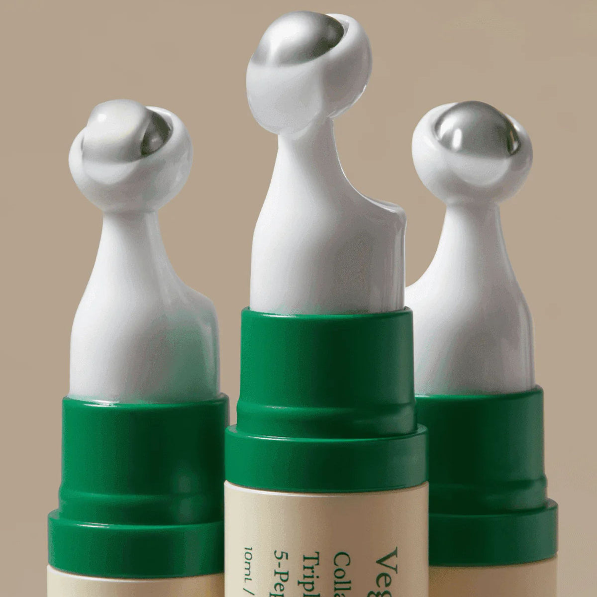 AXIS-Y Vegan Collagen Eye Serum cooling metal applicators – detail shot of 360° massage tip design