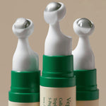 AXIS-Y Vegan Collagen Eye Serum cooling metal applicators – detail shot of 360° massage tip design