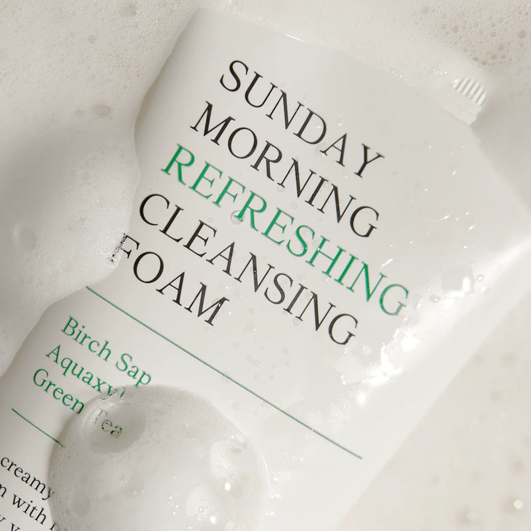 AXIS-Y Sunday Morning Refreshing Cleansing Foam wet packaging detail – birch sap and green tea cleanser for clear hydrated skin