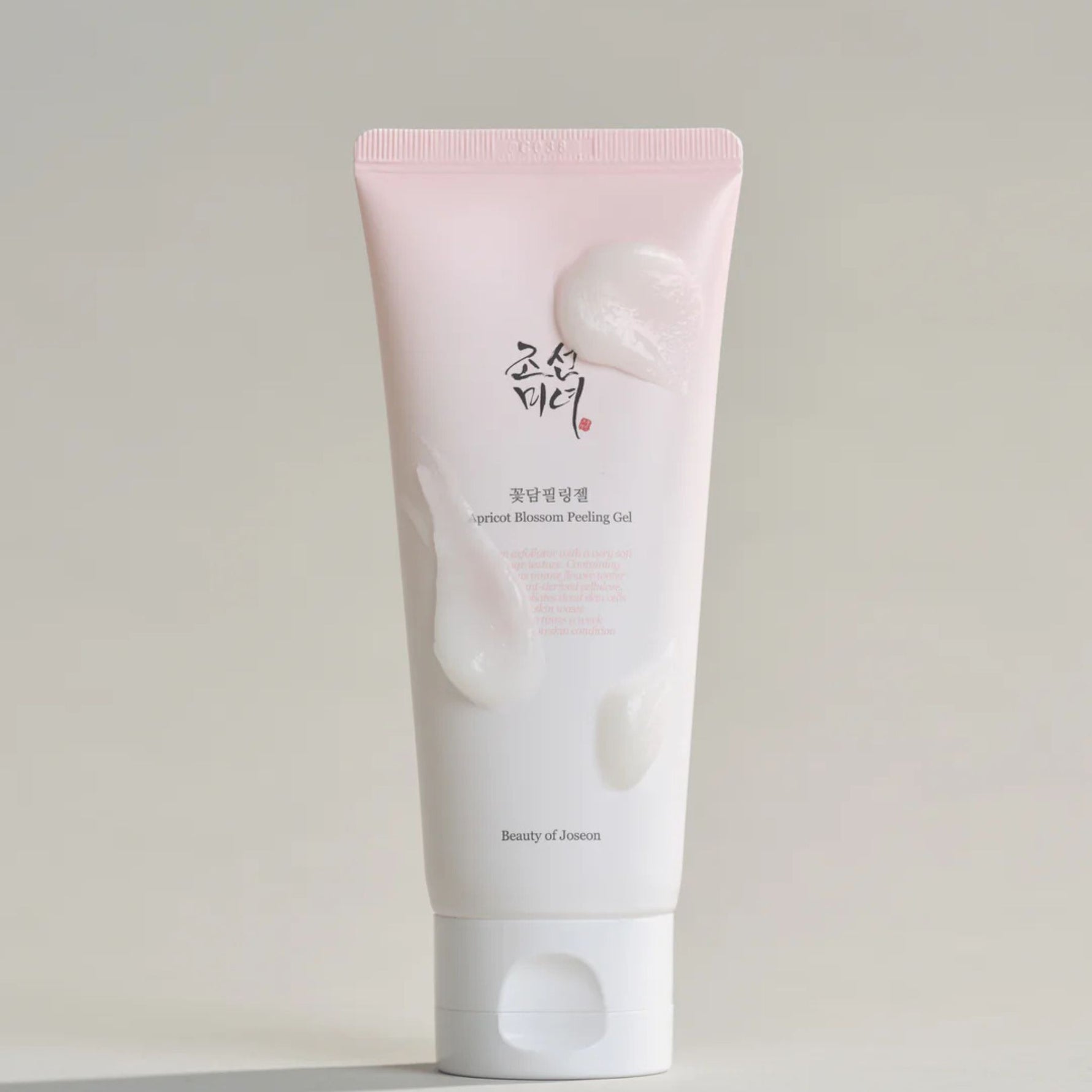 Beauty of Joseon Apricot Blossom Peeling Gel tube with creamy exfoliating gel swatches for gentle skin renewal