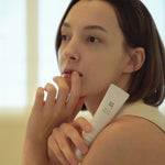 Model holding Beauty of Joseon Revive Eye Serum Ginseng + Retinal – gentle nourishing care for tired under-eyes