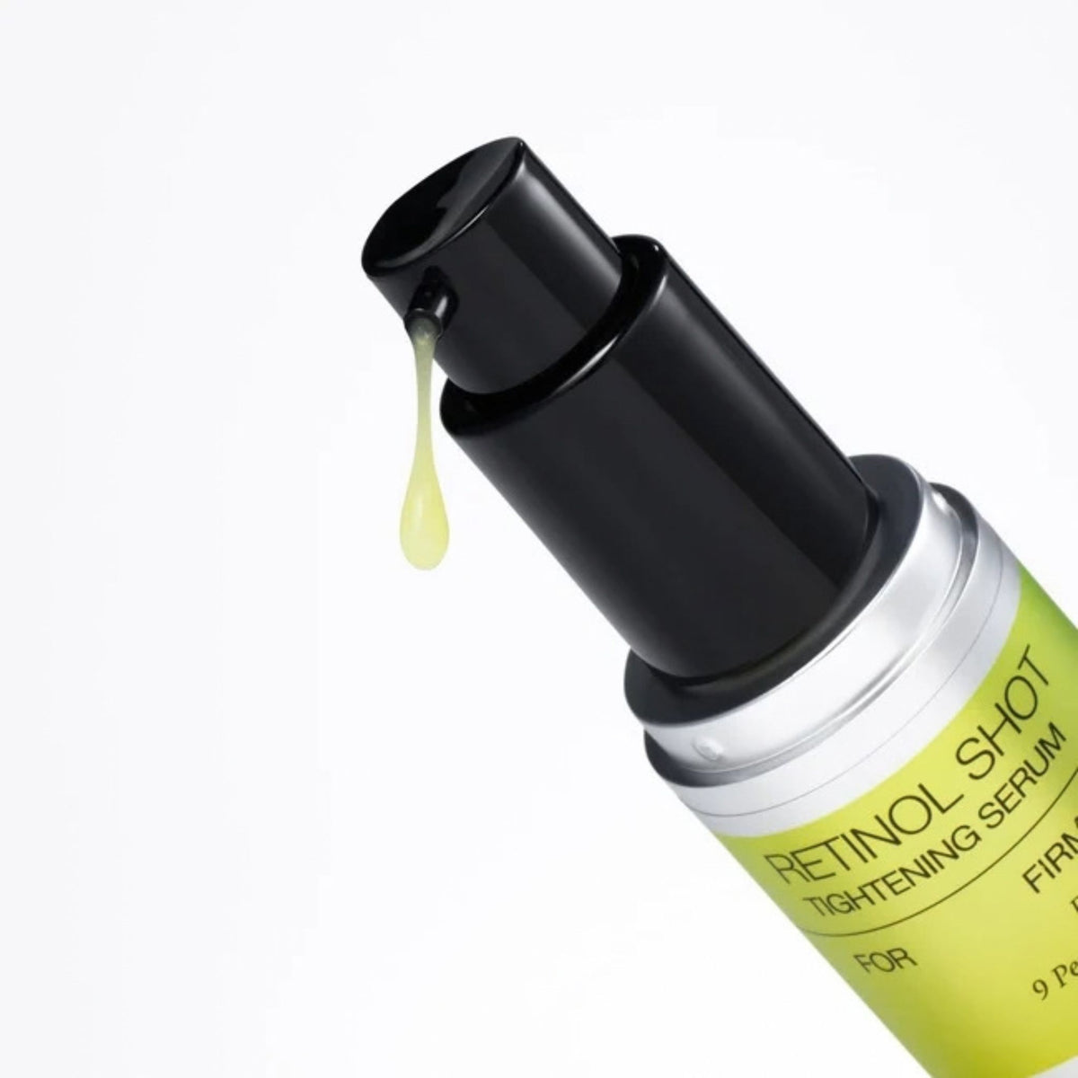 Celimax Retinol Shot Tightening Serum pump dispenser with a drop of lightweight yellow retinol serum