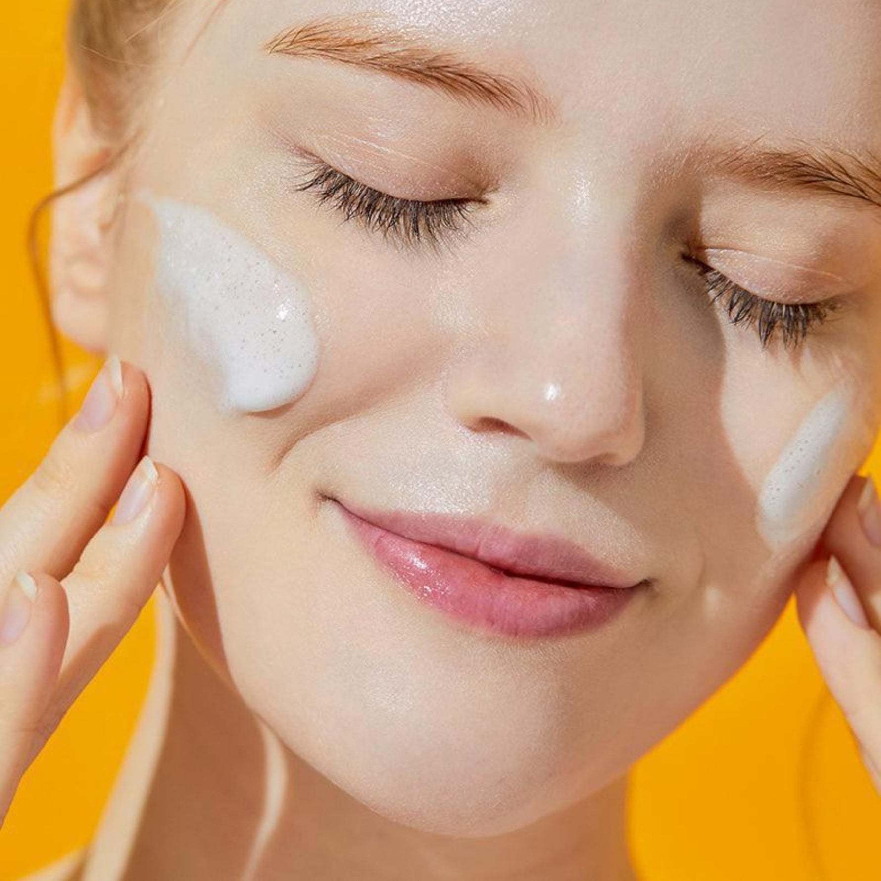 Model using COSRX Advanced Snail Mucin Gel Cleanser – soft foaming texture gently cleanses and hydrates for radiant clear skin