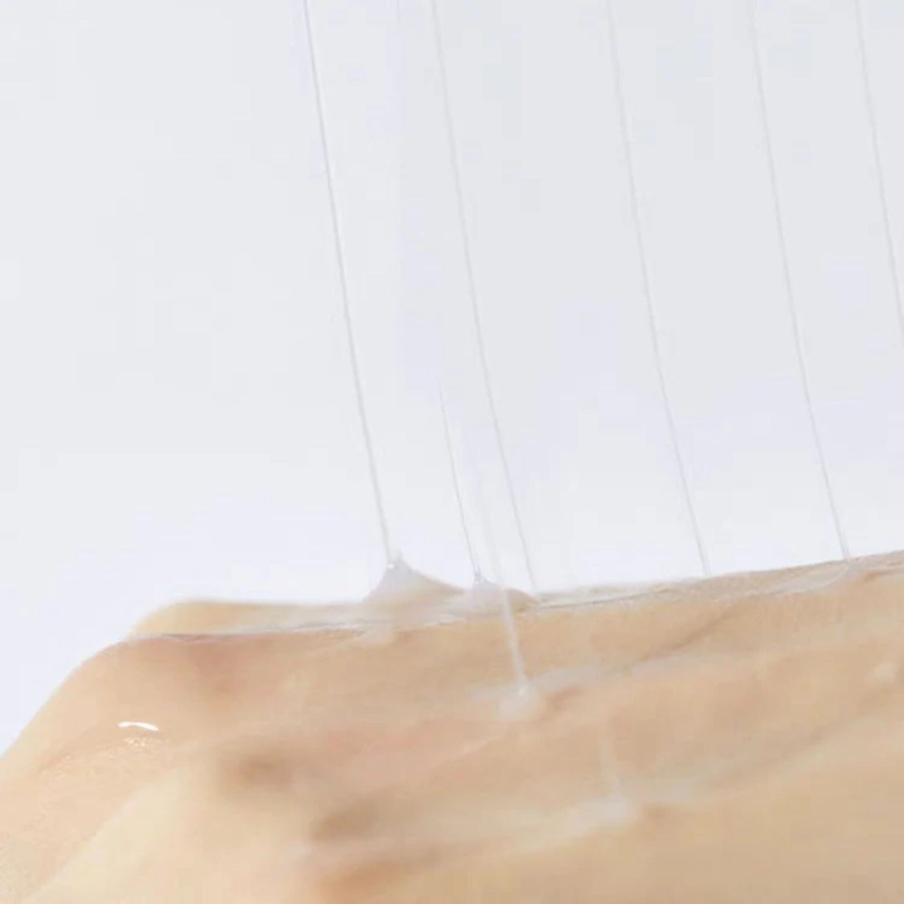 Stretchy texture of COSRX Advanced Snail Radiance Dual Essence – concentrated snail mucin serum for elasticity and moisture barrier repair