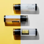 Flat-lay of three COSRX Advanced Snail Radiance Dual Essence bottles – brightening Korean skincare essence with dual-chamber design