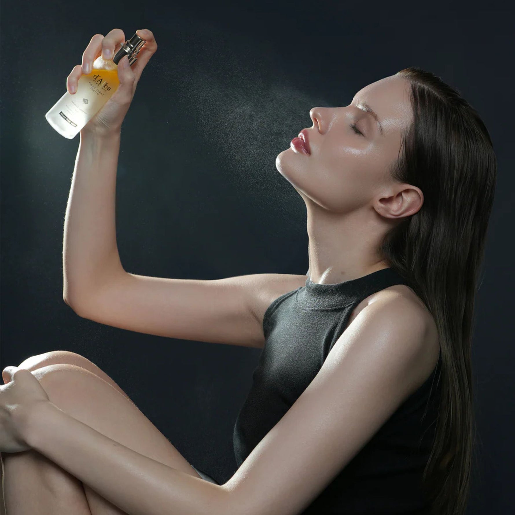 Model using d’Alba First Spray Serum — double-layer facial mist that hydrates and adds radiant glow to skin