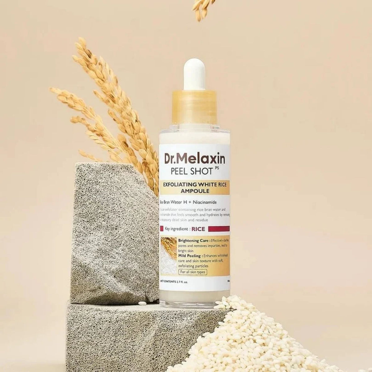 Dr.Melaxin Peel Shot Exfoliating White Rice Ampoule on stone with white rice – gentle peeling serum for smoother skin texture