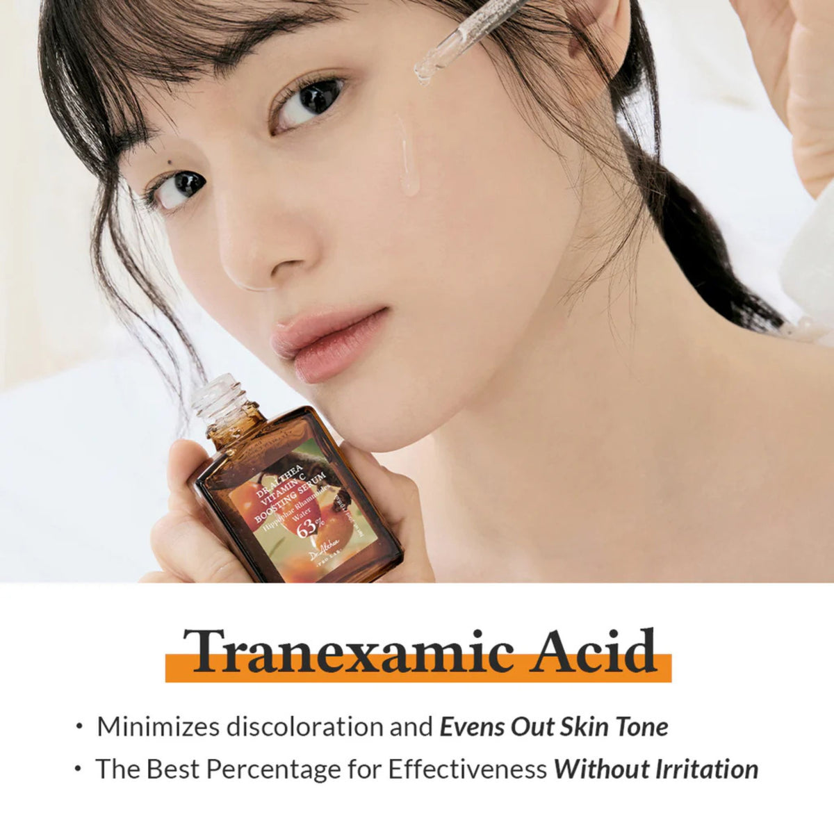 Korean model applying Dr. Althea Vitamin C Boosting Serum with dropper, featuring tranexamic acid to minimize discoloration, even out skin tone, and brighten dull complexion without irritation.