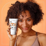Woman with curly hair holding Elizavecca CER-100 Protein Treatment – collagen ceramide hair mask for curly and frizzy hair