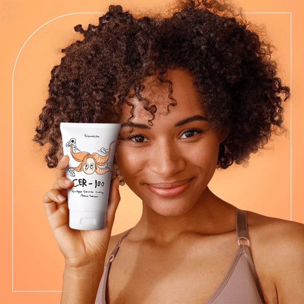 Woman with curly hair holding Elizavecca CER-100 Protein Treatment – collagen ceramide hair mask for curly and frizzy hair