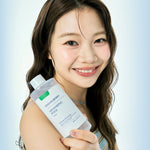 Smiling model holding Eqqualberry Swimming Pool Toner 300ml, Korean hydrating exfoliating toner for daily skincare routine