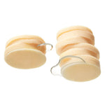 Close-up of stacked Medicube Kojic Acid Turmeric toner pads showing soft textured pad surface