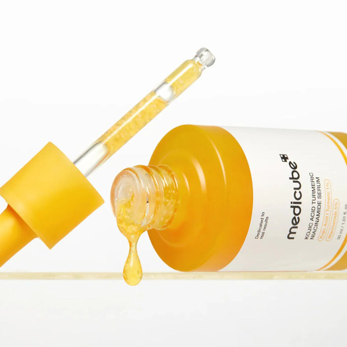 Texture of Medicube Kojic Acid Turmeric Niacinamide Serum showing lightweight brightening serum with niacinamide and kojic acid capsules