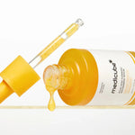Texture of Medicube Kojic Acid Turmeric Niacinamide Serum showing lightweight brightening serum with niacinamide and kojic acid capsules