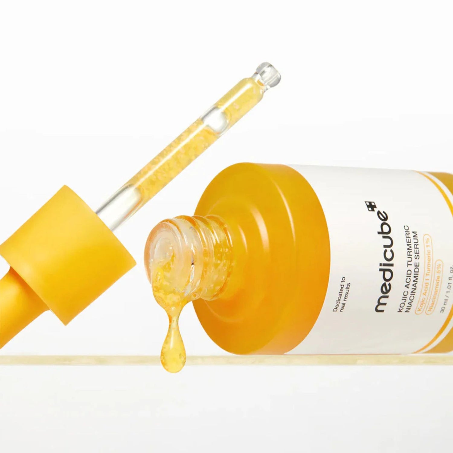 Texture of Medicube Kojic Acid Turmeric Niacinamide Serum showing lightweight brightening serum with niacinamide and kojic acid capsules