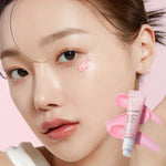 Woman applying Medicube PDRN Pink Peptide Eye Cream Korean skincare for dark circles and fine lines