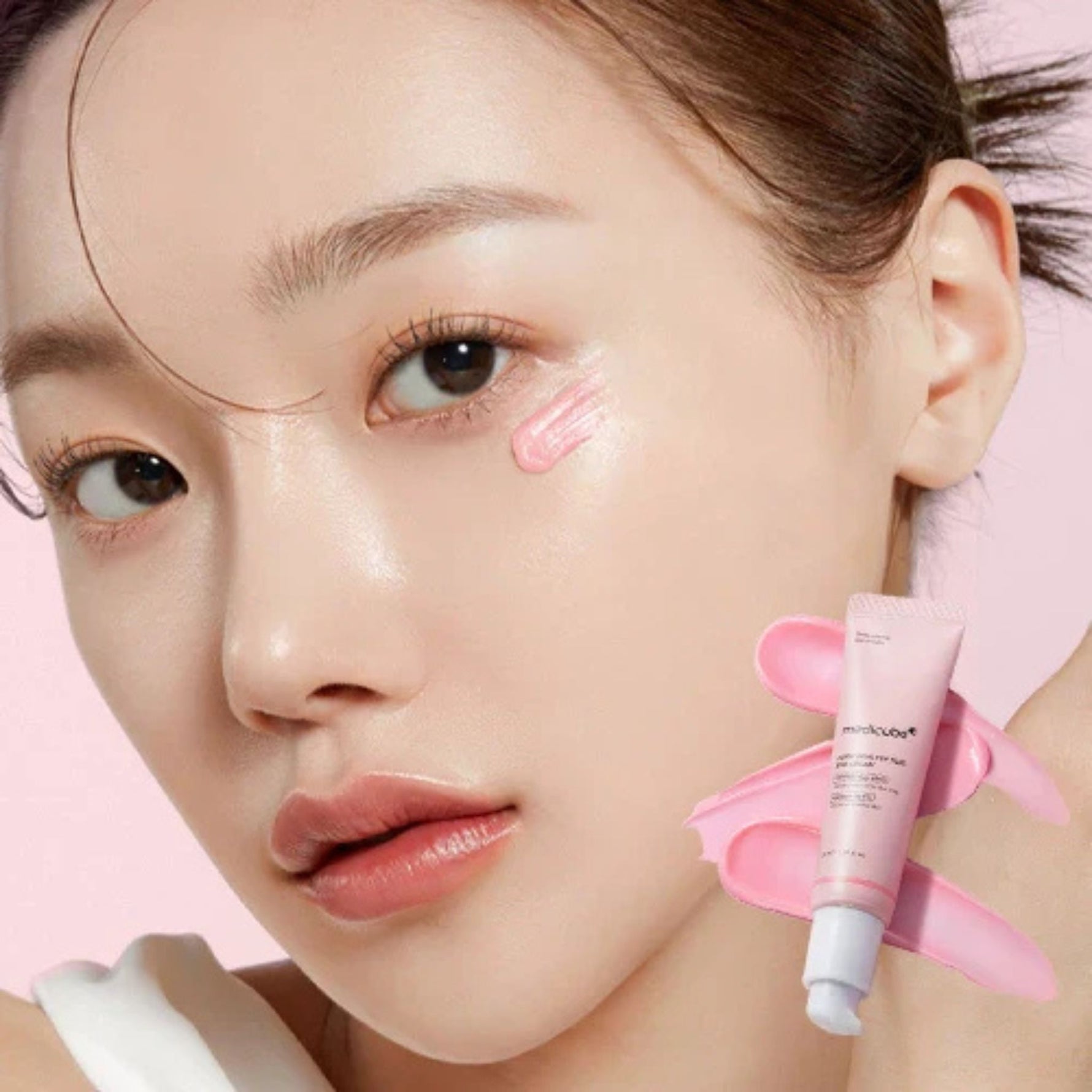 Woman applying Medicube PDRN Pink Peptide Eye Cream Korean skincare for dark circles and fine lines