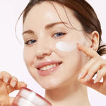 Model applying Medicube Triple Collagen Cream hydrating Korean face cream for plump, radiant, and moisturized skin