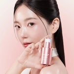 Model holding Medicube PDRN Pink Collagen Exosome Shot 7500 serum showcasing radiant hydrated and youthful-looking skin