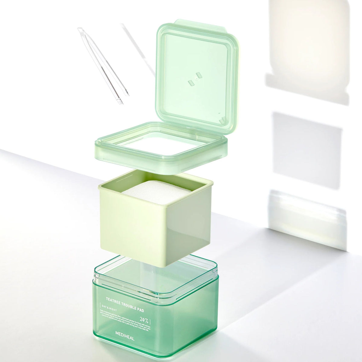 Mediheal Tea Tree Trouble Pad — clean and convenient skincare pad design with hygienic container and tweezers