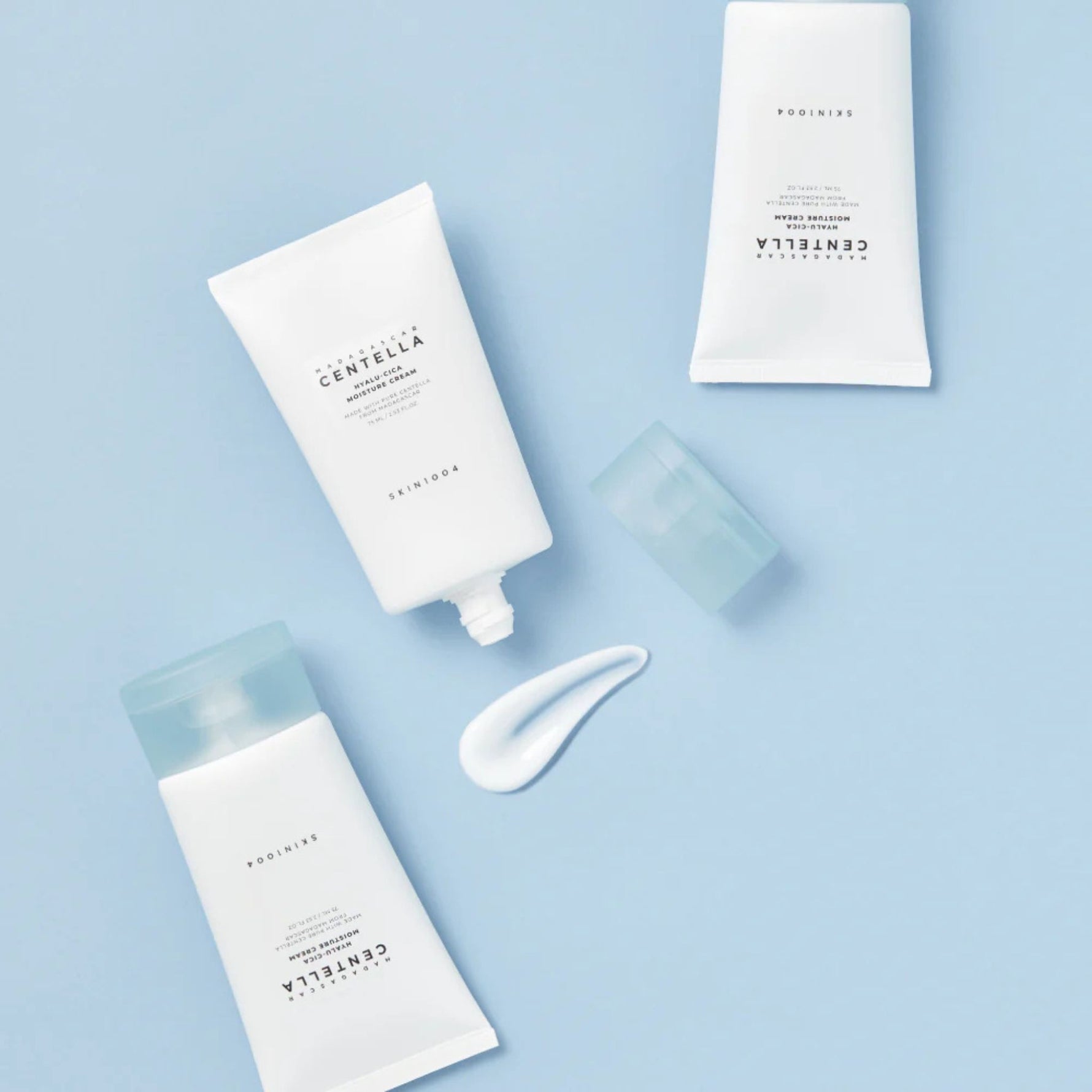 Skin1004 Centella Hyalu-Cica Moisture Cream flat lay with creamy swatch — barrier-strengthening Korean moisturizer for daily hydration