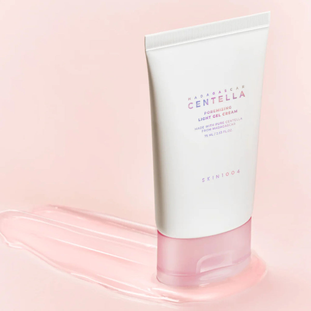 Skin1004 Madagascar Centella Poremizing Light Gel Cream on pink background with gel texture – pore-minimizing lightweight moisturizer with cooling hydration effect.